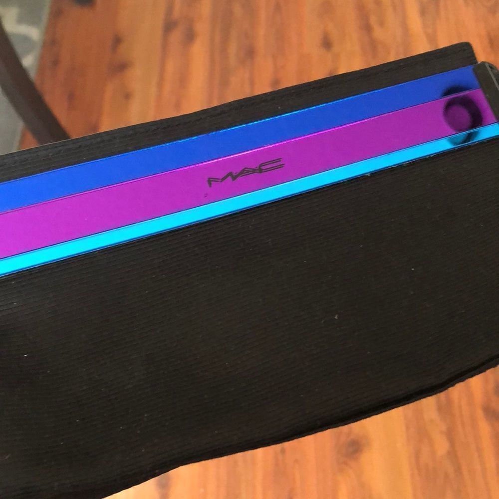 MAC Cosmetics black andโpurple bag.